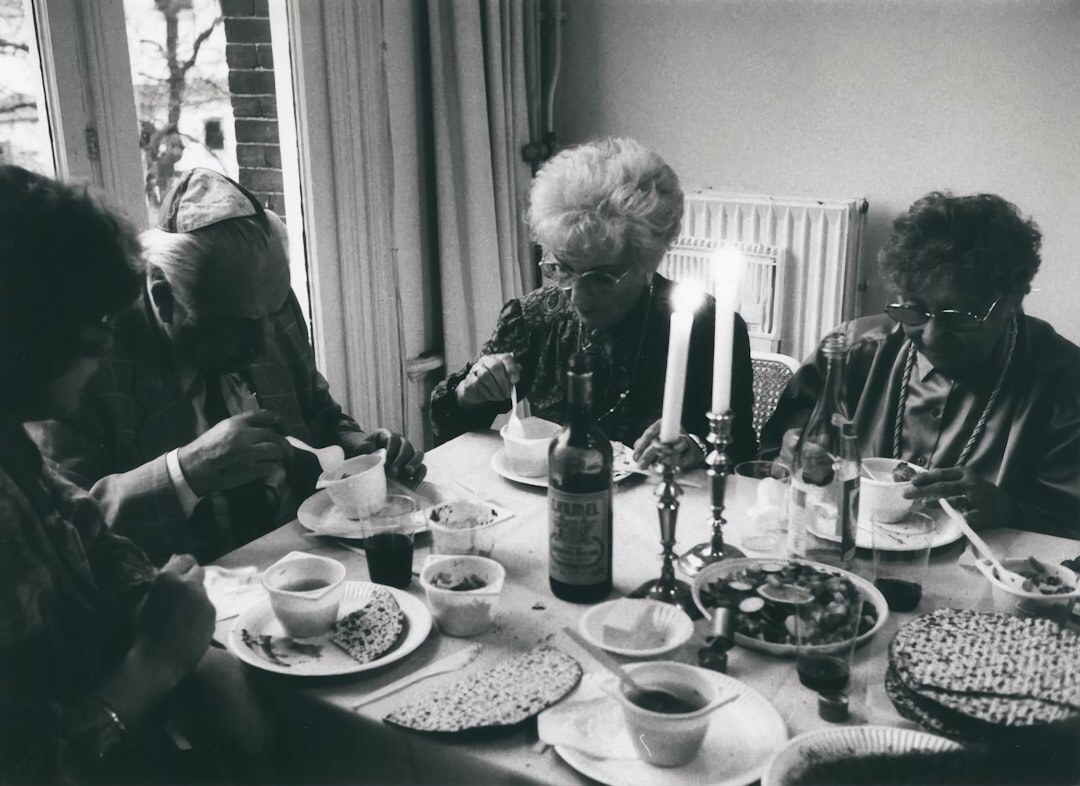 senior woman drinking tea with friends
