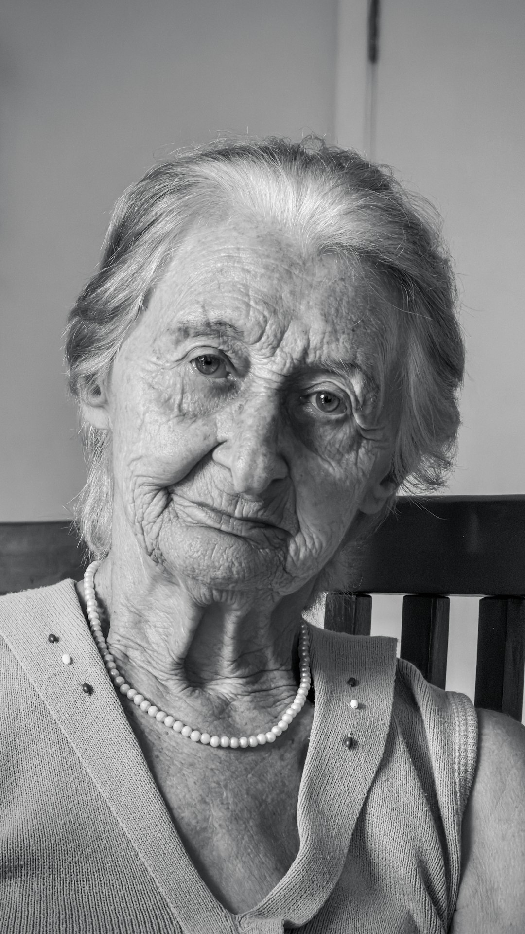 Studio portrait of a smiling elderly woman