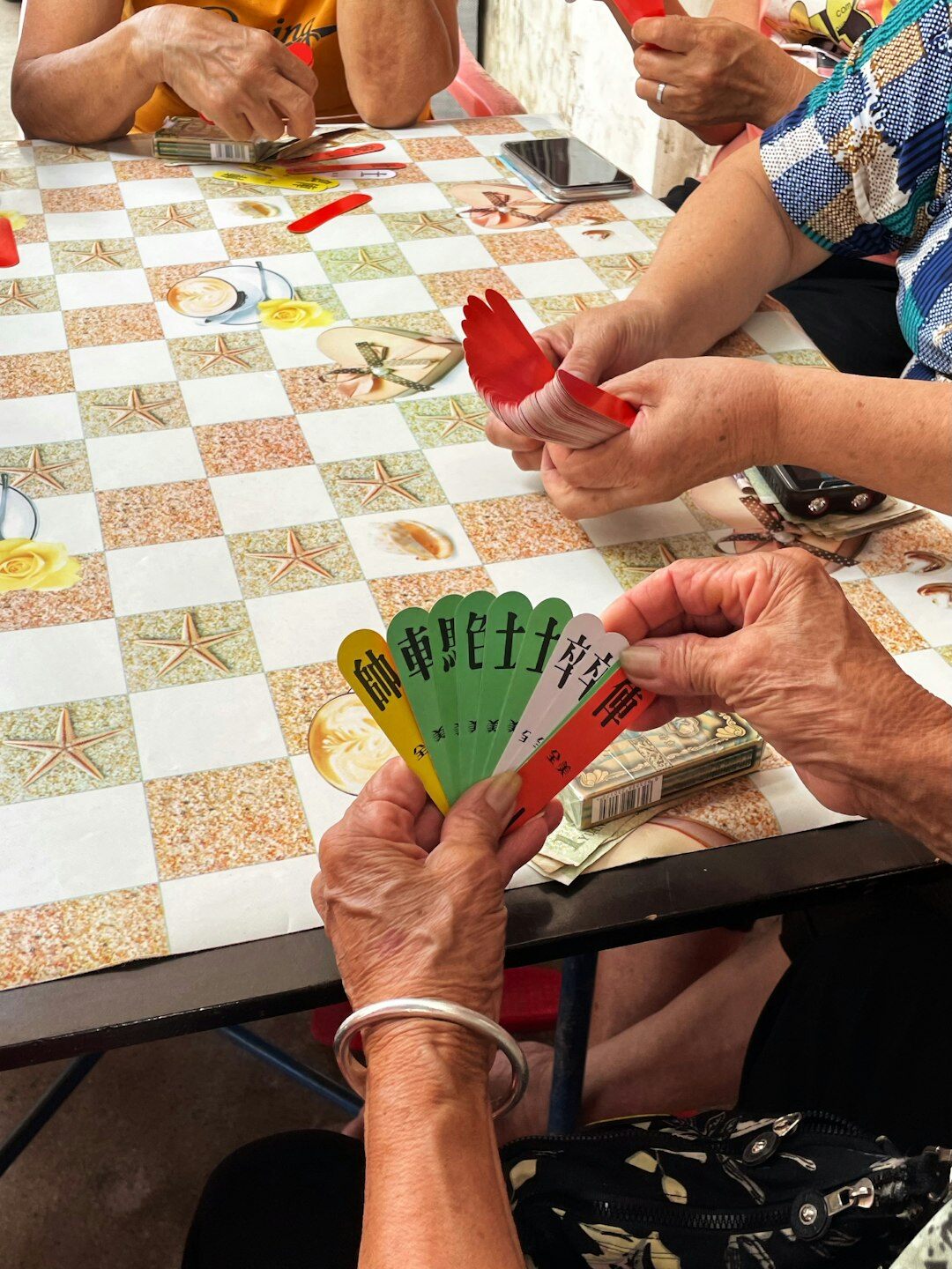group of seniors playing cards