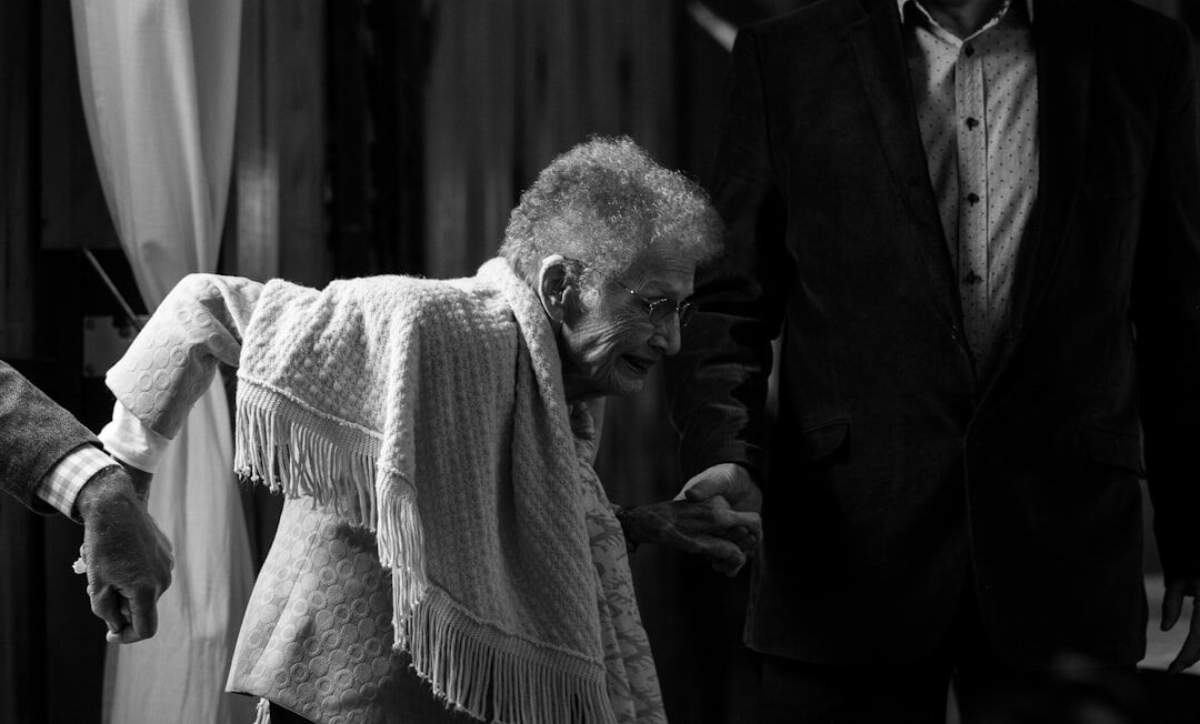 Senior couple dancing together in a community hall